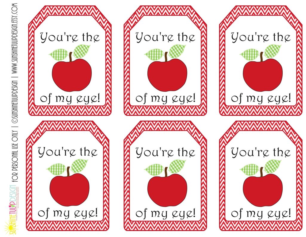 Free Printable Teacher Appreciation Tags featuring red apples and the phrase 'You're the apple of my eye!'